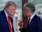 US President Donald Trump speaks with Canadian Prime Minister Mark Carney at a working lunch with leaders of G7 and the Middle East, in Evian-les-Bains, France, on June 16. (REUTERS)