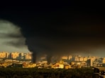 This photograph shows smoke rising following Russian missiles strike in Kyiv, Ukraine, early on September 8, 2026, amid Russian invasion in Ukraine. A wave of strong explosions rang out in Kyiv, AFP journalists said, as Russia resumed strikes on the Ukrainian capital after a three-day halt. Russian President Vladimir Putin had ordered the pause in attacks as US President Donald Trump's envoys Steve Witkoff and Jared Kushner visited the Russian and Ukrainian capitals at the weekend.(AFP)