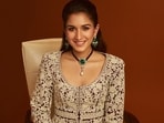 Radhika Merchant wears stunning emerald and diamond jewels. 