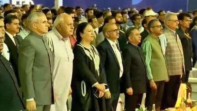 Jammu and Kashmir Chief Minister Omar Abdullah and J&K National Conference president Farooq Abdullah stand for Vande Mataram.