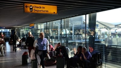 People sit on the floor with their luggage inside Terminal 5 of London Heathrow Airport, west of London, on September 8, 2026, following major disruption. (File Photo/AFP) People sit on the floor with their luggage inside Terminal 5 of London Heathrow Airport, west of London, on September 8, 2026, following major disruption. (File Photo/AFP)