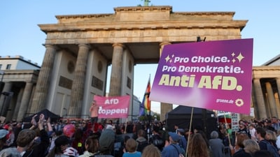 A demonstrator wears items signalling opposition to the far-right Alternative for Germany (AfD) party, during a protest the day after the party's victory in state elections in Saxony-Anhalt at the Brandenburg Gate in Berlin, Germany, September 7, 2026. A demonstrator wears items signalling opposition to the far-right Alternative for Germany (AfD) party, during a protest the day after the party's victory in state elections in Saxony-Anhalt at the Brandenburg Gate in Berlin, Germany, September 7, 2026.
