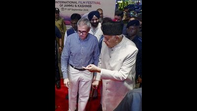 Jammu and Kashmir CM Omar Abdullah with his father and JKNC chief Farooq Abdullah during the screening of "Mirzapur: The Movie" at International Film Festival of J-K, in Srinagar on Tuesday. (PTI) Jammu and Kashmir CM Omar Abdullah with his father and JKNC chief Farooq Abdullah during the screening of "Mirzapur: The Movie" at International Film Festival of J-K, in Srinagar on Tuesday. (PTI)
