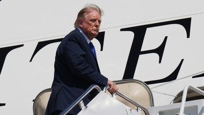 President Donald Trump is seen boarding the Qatar-gifted Air Force One after an emergency inflatable slide deployed before he arrived at Joint Base Andrews. President Donald Trump is seen boarding the Qatar-gifted Air Force One after an emergency inflatable slide deployed before he arrived at Joint Base Andrews.