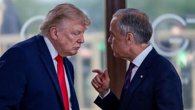 US President Donald Trump speaks with Canadian Prime Minister Mark Carney at a working lunch with leaders of G7 and the Middle East, in Evian-les-Bains, France, on June 16. (REUTERS) US President Donald Trump speaks with Canadian Prime Minister Mark Carney at a working lunch with leaders of G7 and the Middle East, in Evian-les-Bains, France, on June 16. (REUTERS)