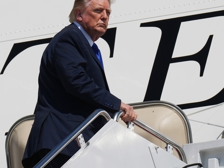 President Donald Trump is seen boarding the Qatar-gifted Air Force One after an emergency inflatable slide deployed before he arrived at Joint Base Andrews.