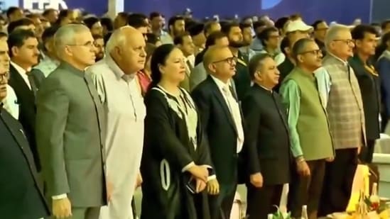 Jammu and Kashmir Chief Minister Omar Abdullah and J&K National Conference president Farooq Abdullah stand for Vande Mataram.