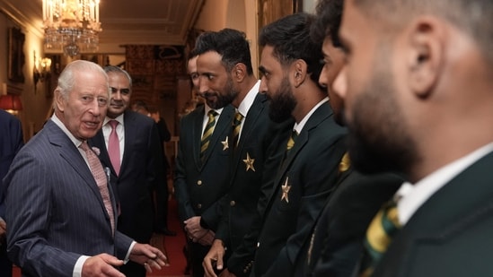 Britain's King Charles III speaks with members of the Pakistan National Cricket Team.