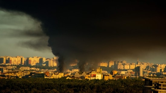 This photograph shows smoke rising following Russian missiles strike in Kyiv, Ukraine, early on September 8, 2026, amid Russian invasion in Ukraine. A wave of strong explosions rang out in Kyiv, AFP journalists said, as Russia resumed strikes on the Ukrainian capital after a three-day halt. Russian President Vladimir Putin had ordered the pause in attacks as US President Donald Trump's envoys Steve Witkoff and Jared Kushner visited the Russian and Ukrainian capitals at the weekend.