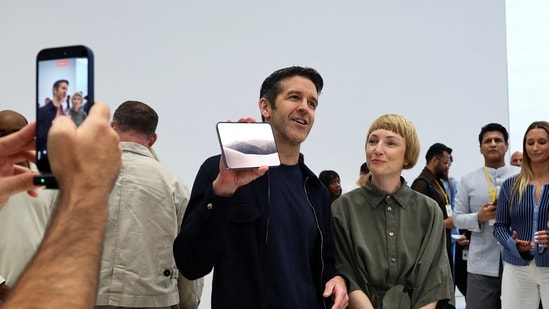 Apple CEO John Ternus holds the new foldable iPhone Duo during Apple's event at the Steve Jobs Theater on September 9.