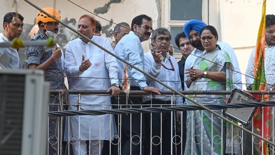 Municipal Corporation of Delhi (MCD) Commissioner Sanjeev Khirwar (2nd from left) at the site of a collapsed building in Satya Niketan, on Monday (Vipin Kumar/Hindustan Times)