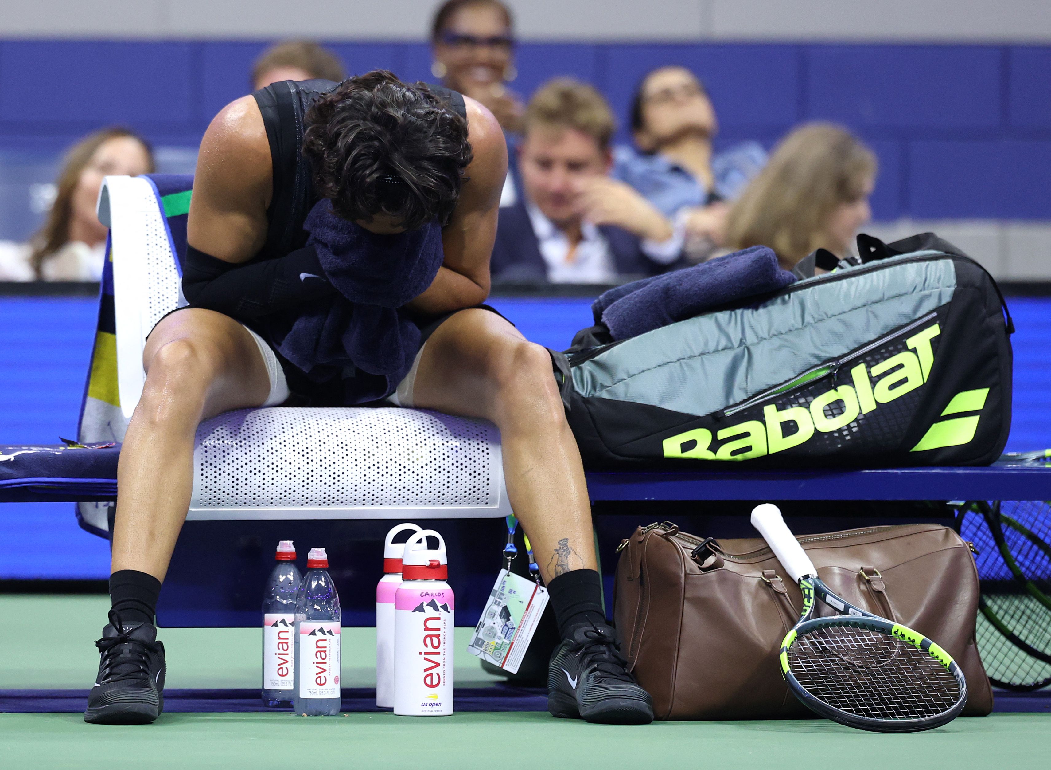 Carlos Alcaraz of Spain appears to be sick in his match against Ben Shelton of the United States during their Men's Singles Quarterfinal match on Day Ten of the 2026 US Open (Getty Images via AFP) Carlos Alcaraz of Spain appears to be sick in his match against Ben Shelton of the United States during their Men's Singles Quarterfinal match on Day Ten of the 2026 US Open (Getty Images via AFP)