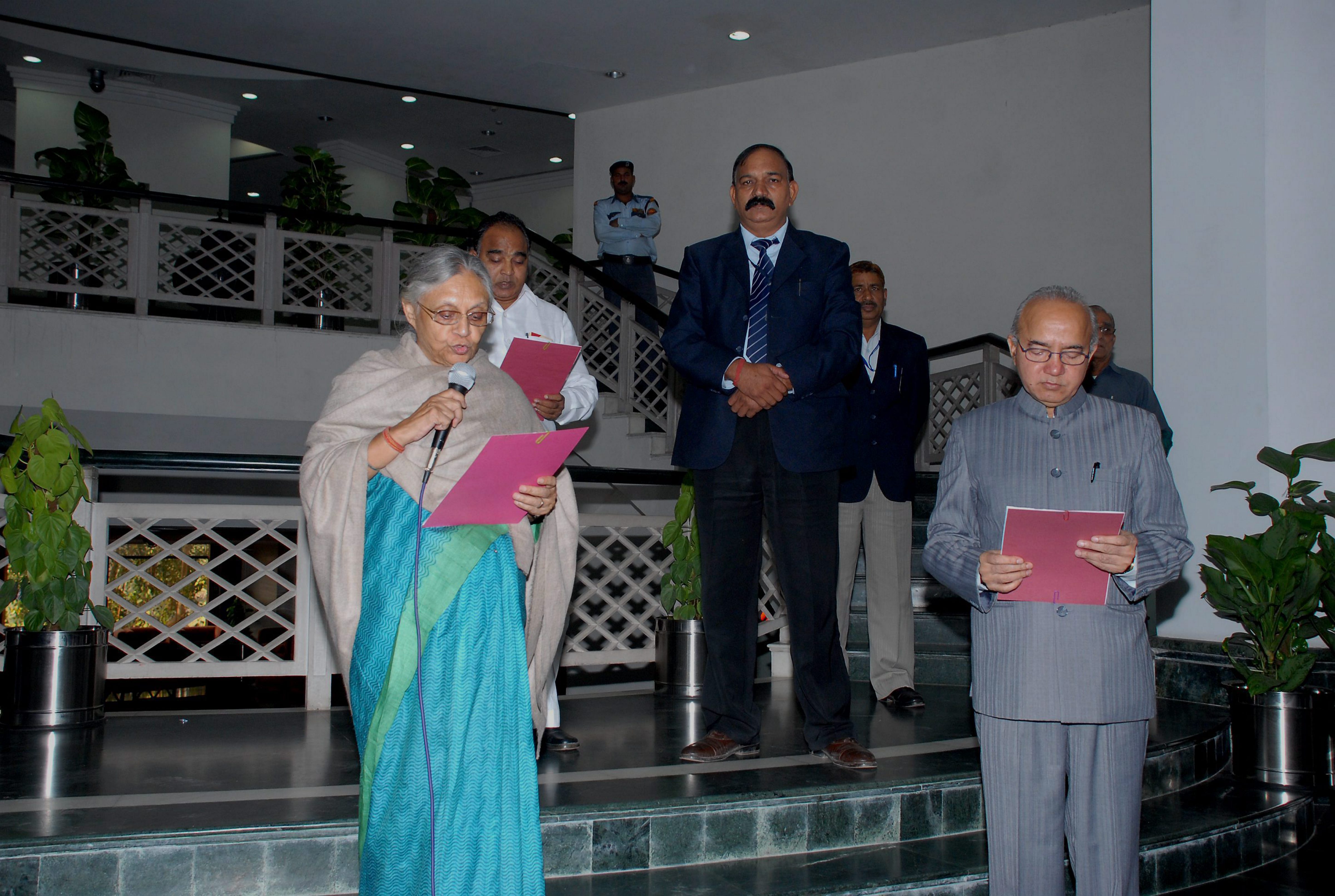 Former Delhi chief secretary Rakesh Mehta is seen during his oath-taking ceremony with then Delhi CM Sheila Dikshit. (PTI)