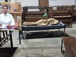 A viral image of the college principal Vajala Ravi, who chose to sleep on campus to ensure the displaced students felt safe through the night, has won the hearts of students.