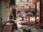 New Delhi, Sep 08 (ANI): Workers clear the debris in the presence of security personnel at the site of the Satya Niketan building collapse (6th Sep), in New Delhi on Tuesday. (ANI Photo)