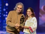 Filmmaker Imtiaz Ali presents an award during the closing ceremony of the International Film Festival of J-K in Srinagar Thursday. (PTI)