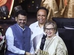 Maharashtra Chief Minister Devendra Fadnavis presents the Lifetime Achievement Award for 2025 to Helen Ann Richardson Khan at the 62nd Marathi Cinema Awards. (ANI Photo)