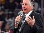 FILE - Former Los Angeles Kings coach Barry Melrose speaks to fans as he is honored prior to an NHL hockey game between the Kings and the Calgary Flames, on Feb. 12, 2015, in Los Angeles. (AP Photo/Mark J. Terrill, File)