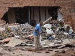Seven persons, mostly students, died on September 6 after a multi-storey building crashed in Delhi's Satya Niketan.(In picture: A worker at the building collapse site)