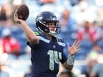 Quarterback Sam Darnold appeared to be limping after being driven into the ground.(AP Photo)