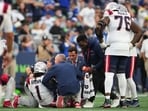 New England Patriots wide receiver A.J. Brown (1) is tended to on the field during the second half of an NFL football game against the Seattle Seahawks.