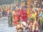 People perform Chhath Puja at Bhalswa Lake in New Delhi on Wednesday. Chhath Puja is significant to the Purvanchali community. (Sanchit Khanna/HT Photo)