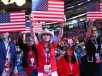 Delegates wave American flag signs on the second day of the 2026 Republican National Convention at the American Airlines Center on September 10, 2026   Kevin Dietsch/Getty Images/AFP (Photo by Kevin Dietsch / GETTY IMAGES NORTH AMERICA / Getty Images via AFP)
