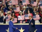 Singer Lee Greenwood, left, greets US President Donald Trump during the first day of the Republican Midterm Convention at the American Airlines Center in Dallas, Texas.