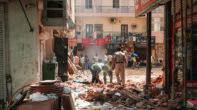 New Delhi, Sep 08 (ANI): Workers clear the debris in the presence of security personnel at the site of the Satya Niketan building collapse (6th Sep), in New Delhi on Tuesday. (ANI Photo) (NEERAJ CHOPRA) New Delhi, Sep 08 (ANI): Workers clear the debris in the presence of security personnel at the site of the Satya Niketan building collapse (6th Sep), in New Delhi on Tuesday. (ANI Photo) (NEERAJ CHOPRA)