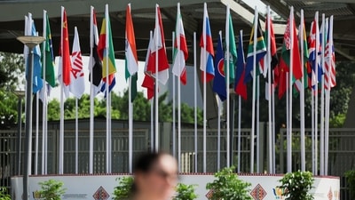 A woman walks past country flags outside Bharat Mandapam, the venue of the upcoming BRICS Summit in New Delhi, India, September 10, 2026. REUTERS/Bhawika Chhabra (REUTERS)