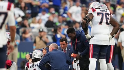 New England Patriots wide receiver A.J. Brown (1) is tended to on the field during the second half of an NFL football game against the Seattle Seahawks. (AP Photo/Lindsey Wasson) New England Patriots wide receiver A.J. Brown (1) is tended to on the field during the second half of an NFL football game against the Seattle Seahawks. (AP Photo/Lindsey Wasson)