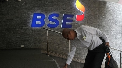 A man touches the stairs as he arrives at the Bombay Stock Exchange (BSE) building in Mumbai (REUTERS/File)