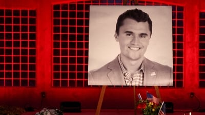 FILE PHOTO: Candles and flowers are placed near an image of Charlie Kirk, during a vigil at Orem City Center Park, after U.S. right-wing activist and commentator, Charlie Kirk, an ally of U.S. President Donald Trump, was fatally shot during an event at Utah Valley University, in Orem, Utah, U.S. September 11, 2025.  REUTERS/Jim Urquhart/File Photo (REUTERS)