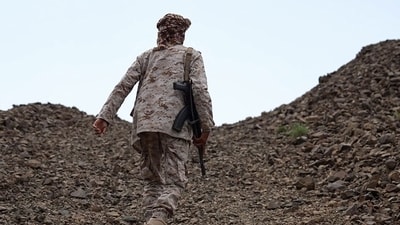 This frame grab taken from AFPTV video footage shows a fighter from the Saudi-backed Nation's Shield Forces deployed in Yemen's Al-Kadha area, west of Taiz province, on September 10, 2026. (AFP)