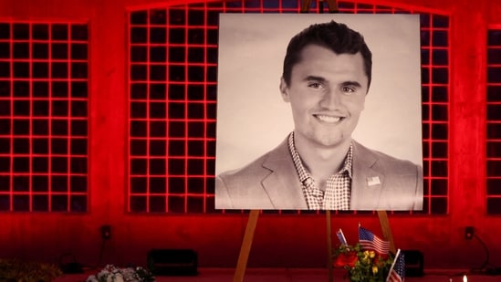 FILE PHOTO: Candles and flowers are placed near an image of Charlie Kirk, during a vigil at Orem City Center Park, after U.S. right-wing activist and commentator, Charlie Kirk, an ally of U.S. President Donald Trump, was fatally shot during an event at Utah Valley University, in Orem, Utah, U.S. September 11, 2025.  REUTERS/Jim Urquhart/File Photo
