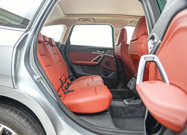 The rear doors open wide, and the space in the back is genuinely surprising for a compact luxury SUV. The rear doors open wide, and the space in the back is genuinely surprising for a compact luxury SUV.