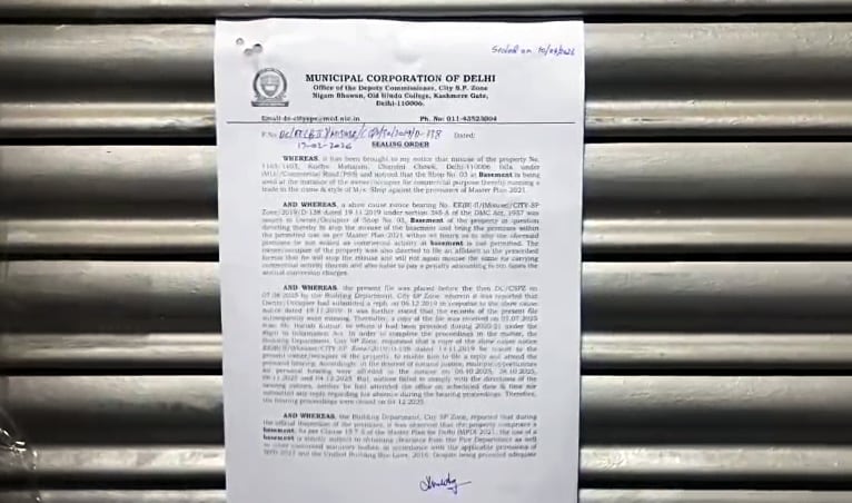 Municipal Corporation of Delhi (MCD) notice on the shutter of a jewellery shop (ANI Video Grab)