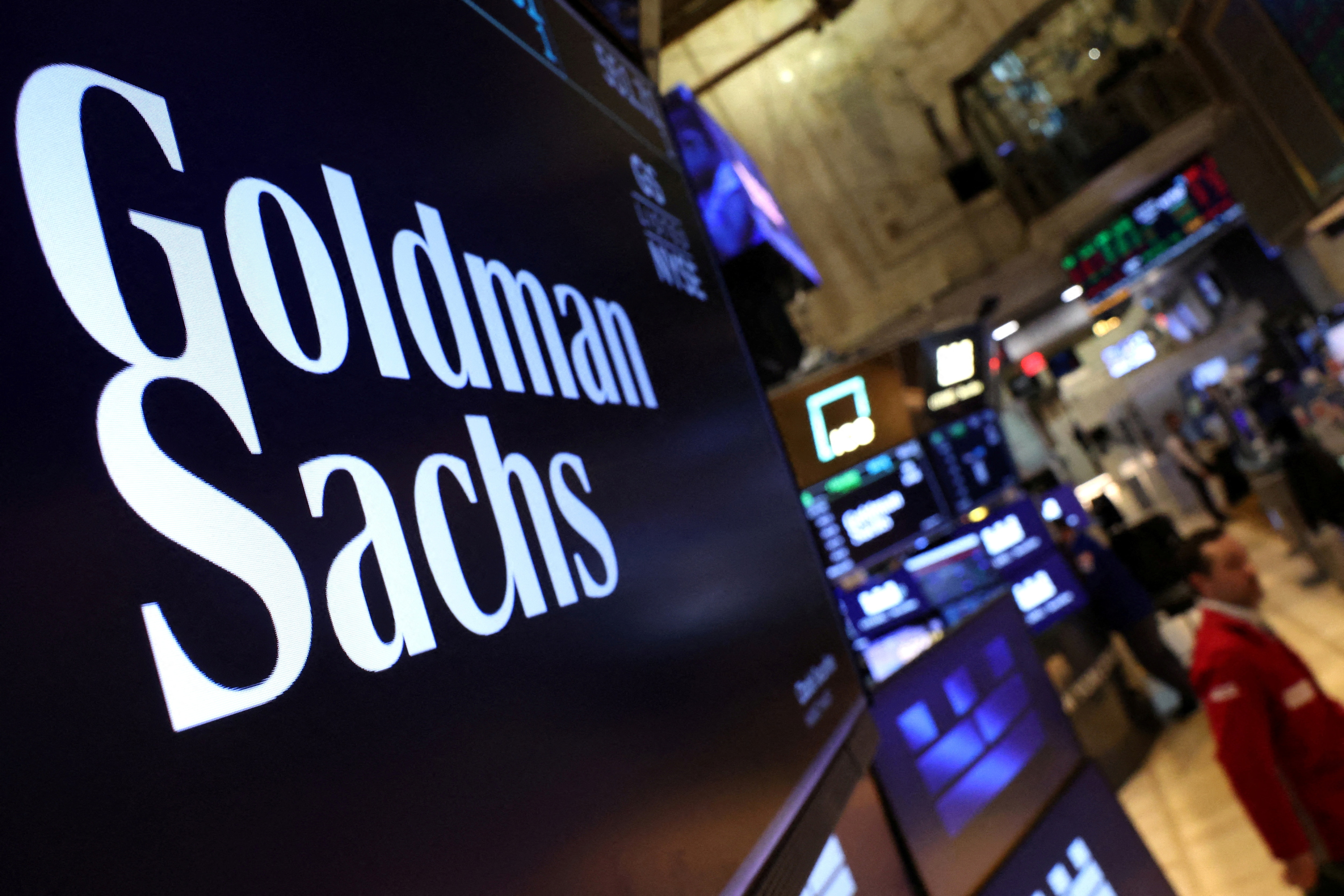 A screen displays the the company logo for Goldman Sachs on the floor at the New York Stock Exchange (NYSE) in New York City. (REUTERS)