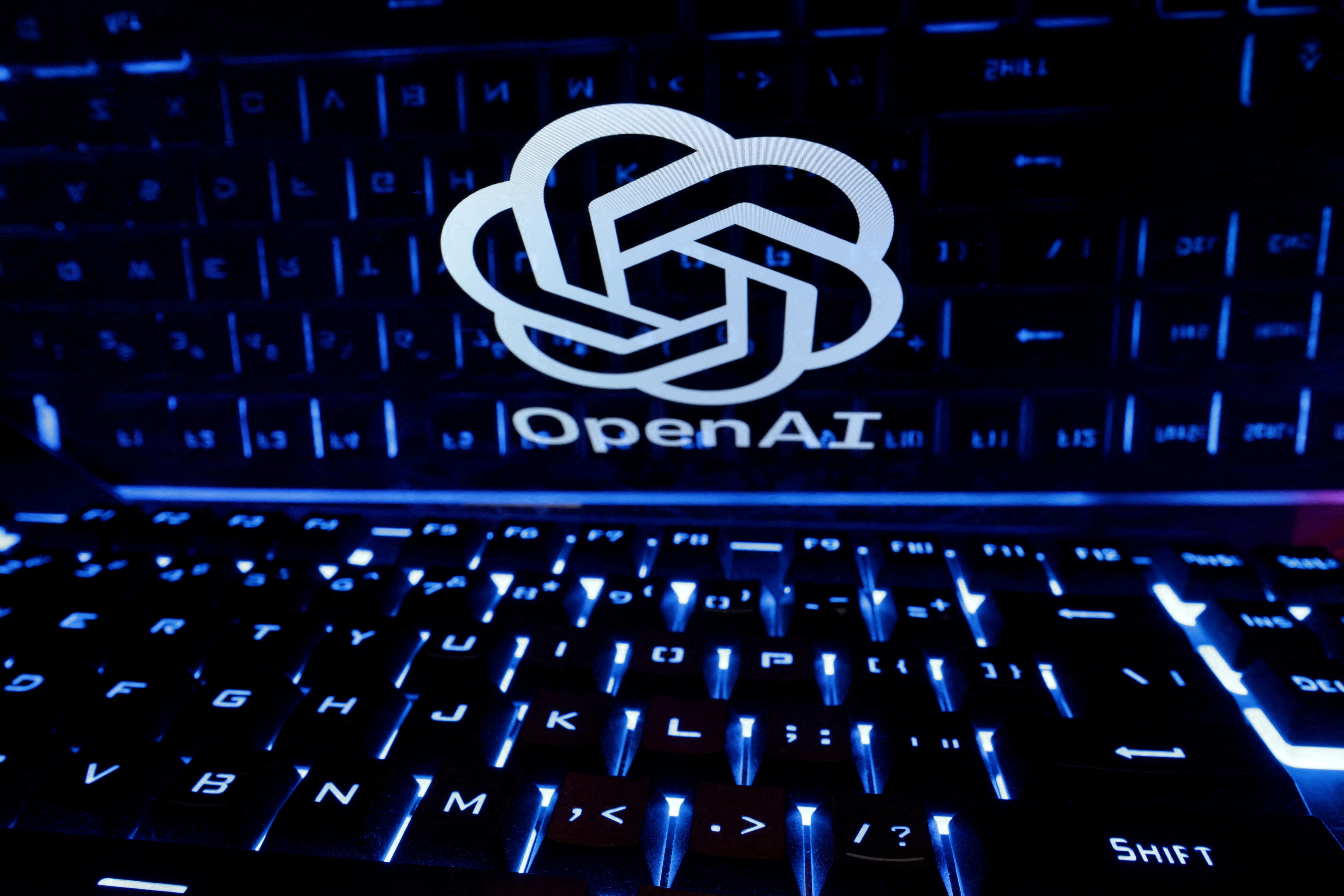 A keyboard is placed in front of a displayed OpenAI logo in this illustration taken February 21, 2023. (REUTERS)