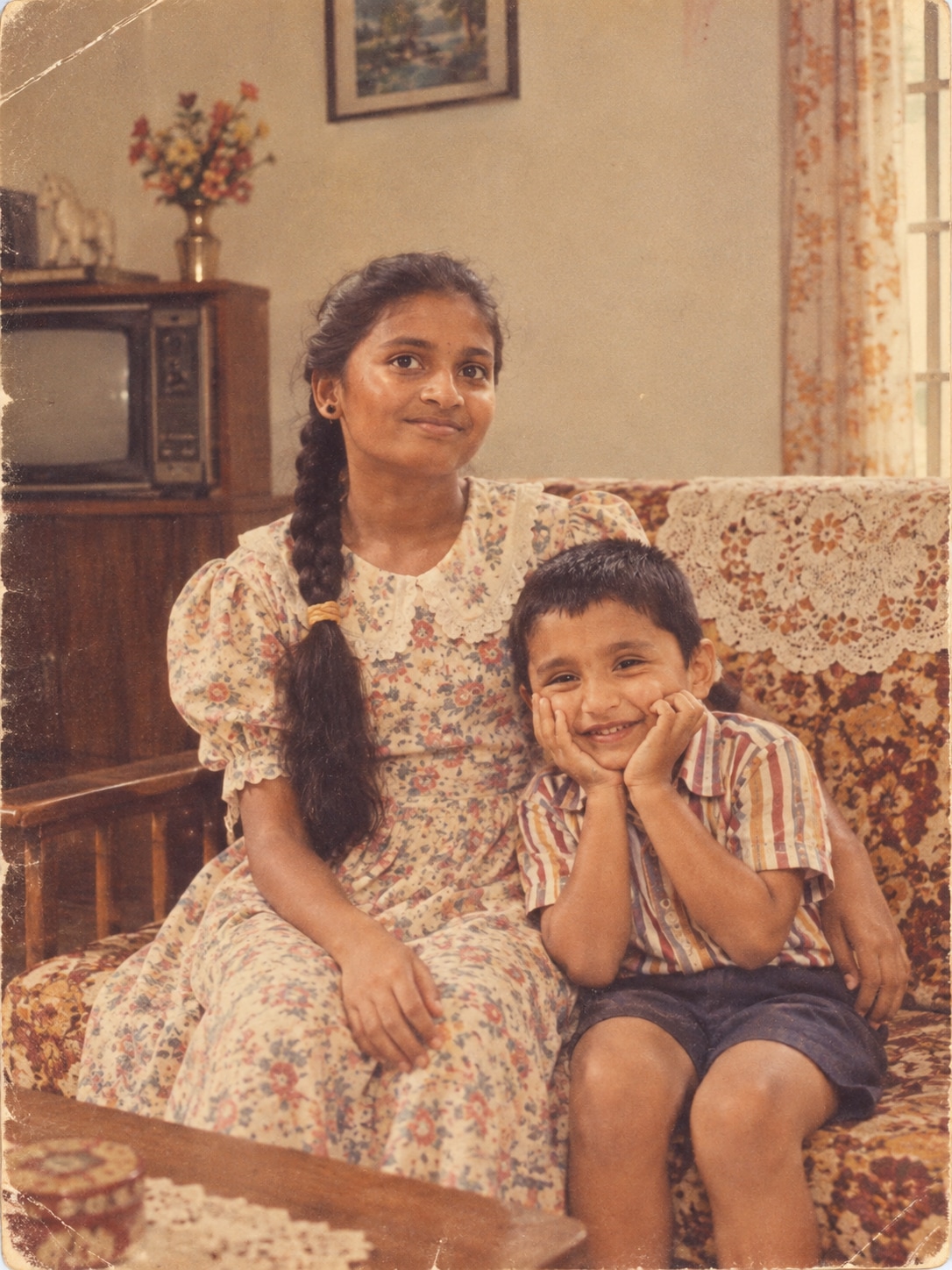 <p>“Turn my uploaded photo into a warm 1980s family album photograph. Keep my face and identity unchanged while giving me period-appropriate clothing, hairstyle and styling. Place me in a simple home setting with the feel of an ordinary family photograph from the decade. Use analogue film texture, slightly faded colours, natural lighting, mild grain and the imperfect quality of an old printed photograph.”</p>
