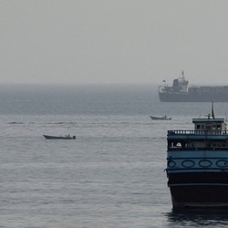 Vessels in the Strait of Hormuz, as seen from Musandam, Oman, August 3, 2026.