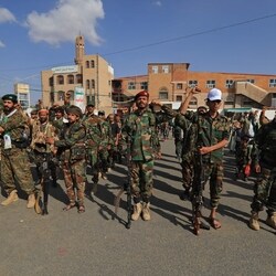 A local official with Yemen's Saudi-backed government said on Friday that the Houthis had "completed their takeover of the Bab al-Mandab area and Mayyun Island". (In picture: Houthi fighters shout slogans during a rally to recruit more fighters)