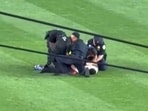 A man identified as Kelly Marcucci, 38, was charged for invading the field at a Yankees-Mets game while chanting and displaying a 'No Kings' jersey./