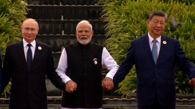 PM Modi walking with Chinese President Xi Jinping and Russia's Vladimir Putin at BRICS Summit 2026 venue in Delhi (DD video grab)