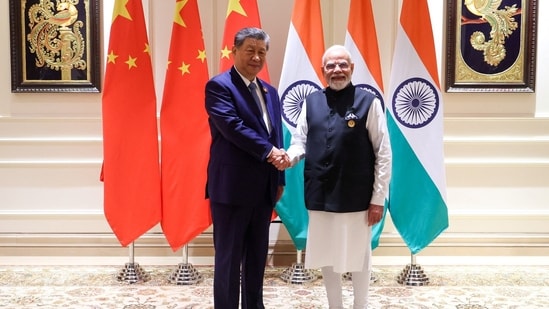 India’s Prime Minister Narendra Modi shakes hands with Chinese President Xi Jinping on the sidelines of the BRICS Summit in New Delh