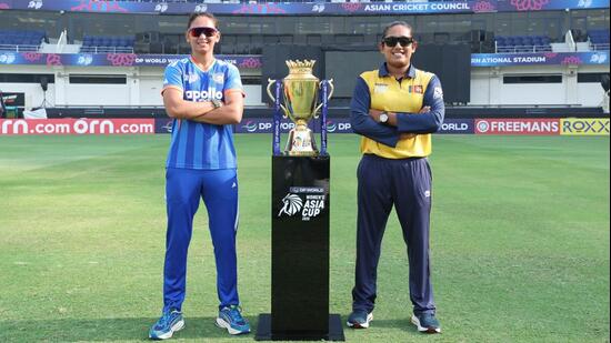 India captain Harmanpreet Kaur (L) and Sri Lanka skipper Chamari Athapaththu pose with the series trophy in Dubai on Saturday. (BCCI)