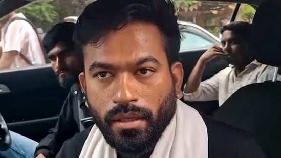 Cockroach Janta Party (CJP) founder Abhijeet Dipke talks to the media as he arrives to visit affected tribal families at a village, in Balaghat district