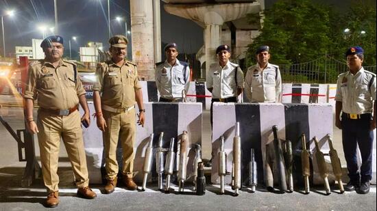 Traffic police personnel with the seized modified bike silencers removed during a crackdown. (Sourced)
