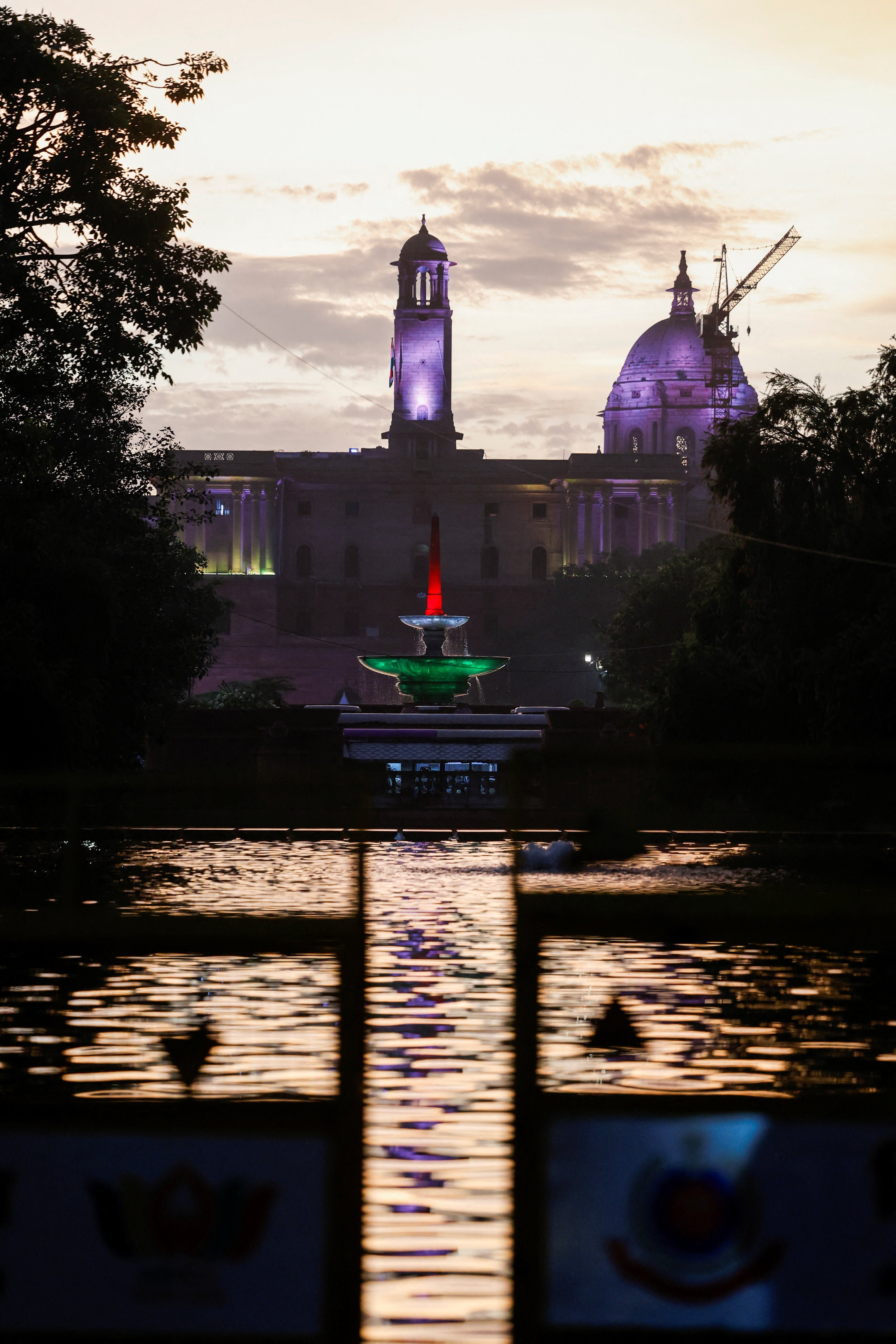 Gram it: Against the evening sky, the silhouette of the Rashtrapati Bhavan bell tower rises beyond a fountain illuminated in the tricolour, creating a striking Delhi frame as the capital marks the final day of the three-day 18th BRICS Summit, with world leaders in the city. (Photo: Sahiba Chawdhary/Reuters)