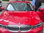 A BMW, along with documents and digital devices containing allegedly incriminating material, was seized.